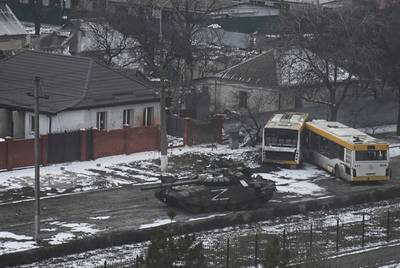 A Russian army tank moves through a street on the outskirts of Mariupol. AP Photo