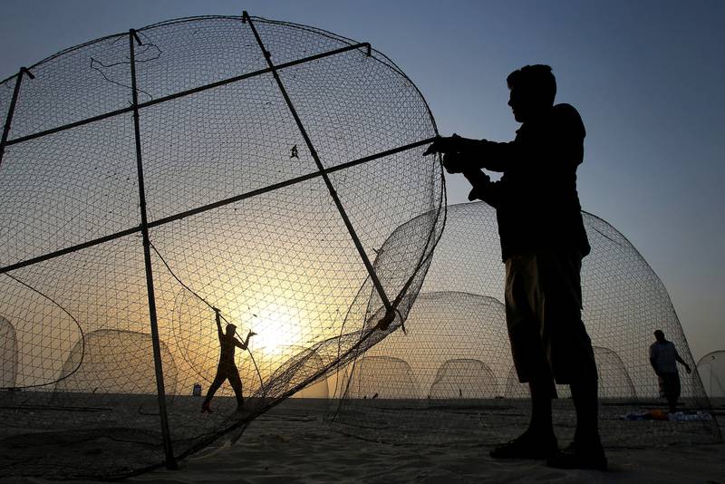 The use of gargoors, a type of traditional fishing cage, is banned in Abu Dhabi. Kamran Jebreili / AP Photo