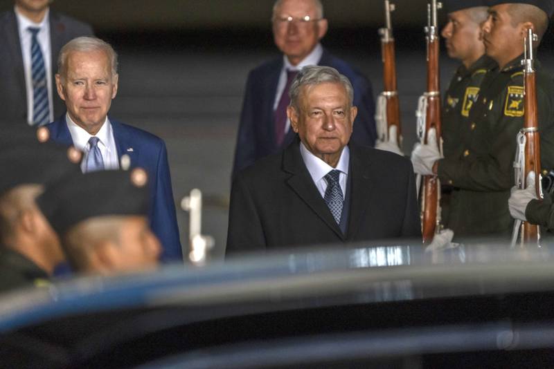 Mexican President Andres Manuel Lopez Obrador, right, welcomes US President Joe Biden at Felipe Angeles International Airport in Mexico. Bloomberg