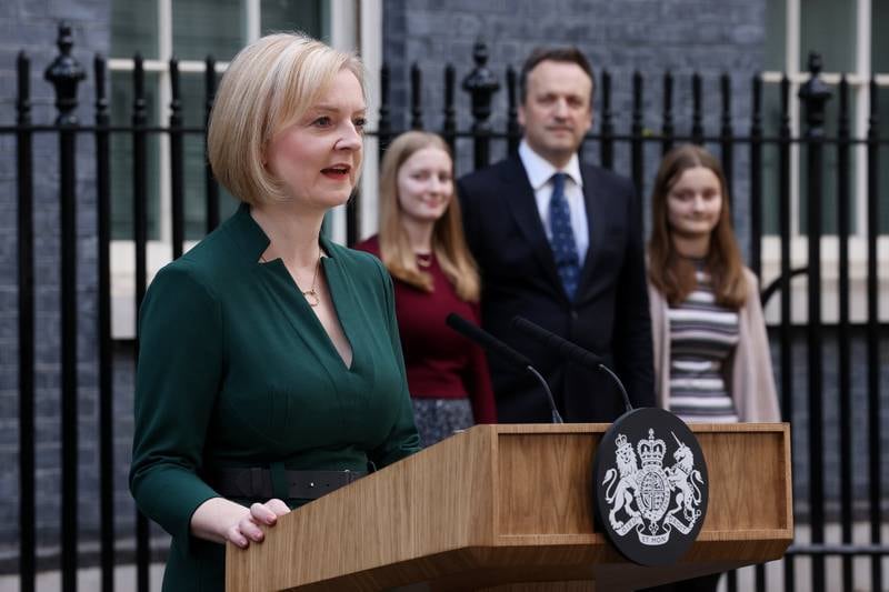 Liz Truss's husband and daughters watch on as she speaks. Getty