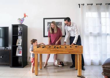 Jorge Camarate and wife Emma Ashworth with their two-year-old son Daniel at their rented villa in the Springs. The couple have taken advantage of the euro's decline by purchasing a property in Lisbon. Reem Mohammed / The National