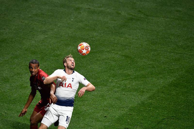 Liverpool's defender Joel Matip fights for the ball with Tottenham Hotspur's striker Harry Kane. AFP