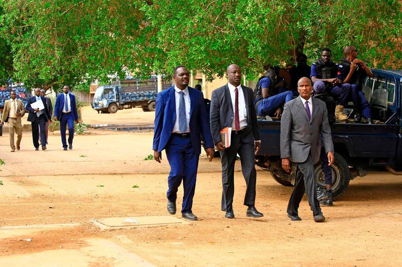 Lawyers arrive for the trial of Sudan's ousted president Omar Al Bashir at a court in the Sudanese capital Khartoum. AFP