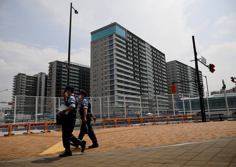 Police officers patrol outside the Olympic Village ahead of the Tokyo 2020 Olympic Games.