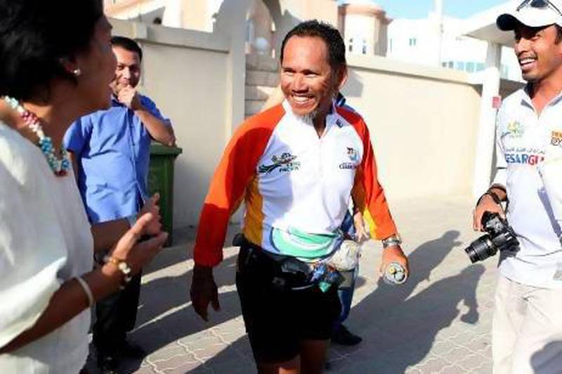 Cesar Guarin, seen here in Abu Dhabi recently, plans to be the first Filipino global runner, covering 42,000km across 47 countries. Fatima Al Marzooqi / The National