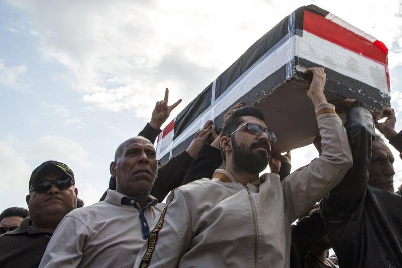 Iraqis carry mock coffins as they take part in a rally to mourn Ahmad Abdessamad, a correspondent for local television station Al-Dijla, and his cameraman Safaa Ghali were shot dead late Friday in Basra. AFP