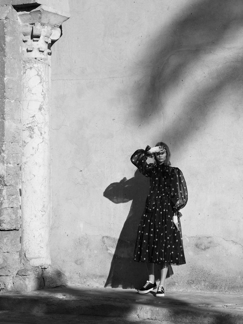OUT OF SHADOWS.Photography | Ezra Patchett | fashion director | Sarah MaiseyDress, Dh9,250, Dolce & Gabbana. Trainers, Dh2,360, Valentino. Polo neck (worn throughout), stylist’s own