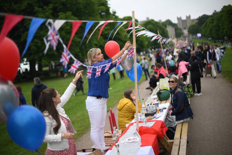 People set up tables for the Big Jubilee Lunch on The Long Walk in Windsor. Millions of people are expected to attend 'Big Jubilee Lunch' picnics as the long weekend of festivities to honour the queen's platinum jubilee concludes. AFP