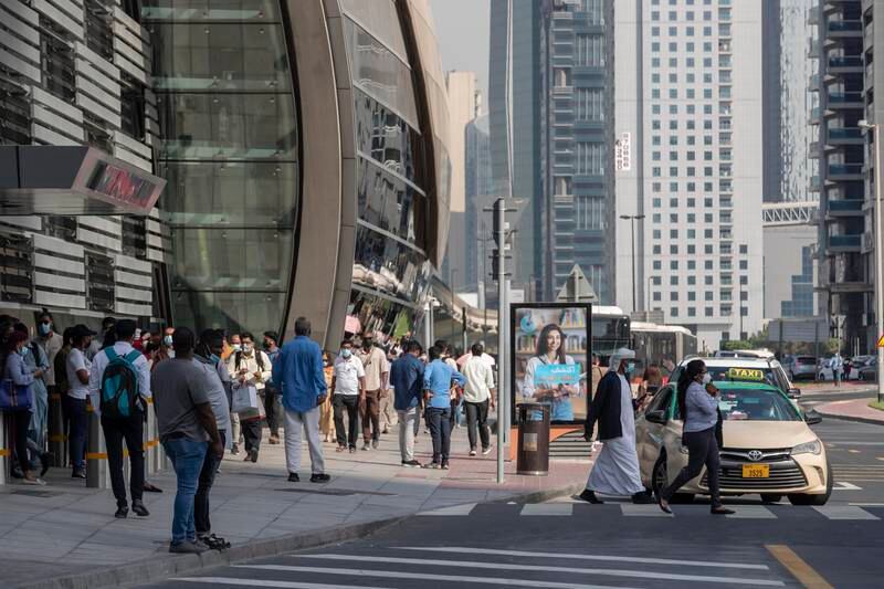 Commuters in Dubai at the Business Bay Metro Station on their way to and from work. Antonie Robertson / The National