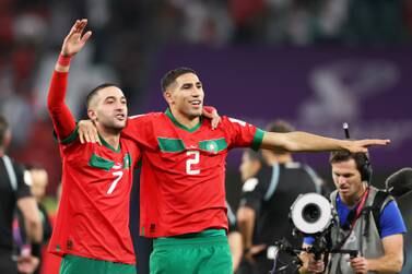 AL RAYYAN, QATAR - DECEMBER 06: Hakim Ziyech and Achraf Hakimi of Morocco celebrate after the team's victory in the penalty shoot out during the FIFA World Cup Qatar 2022 Round of 16 match between Morocco and Spain at Education City Stadium on December 06, 2022 in Al Rayyan, Qatar. (Photo by Catherine Ivill / Getty Images)