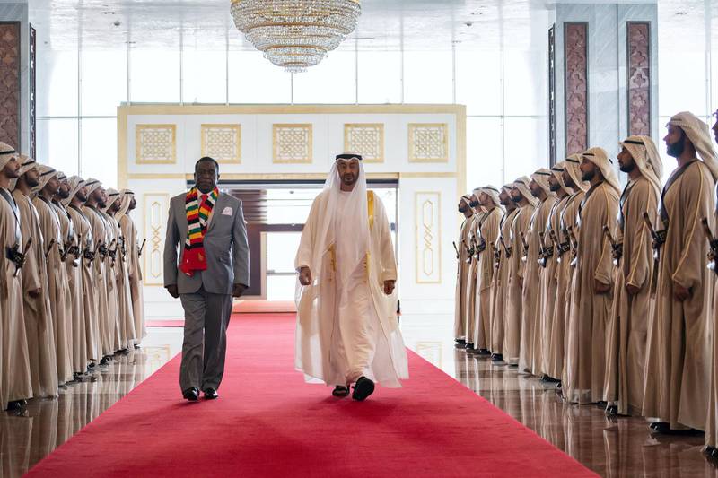 ABU DHABI, UNITED ARAB EMIRATES - March 16, 2019: HH Sheikh Mohamed bin Zayed Al Nahyan Crown Prince of Abu Dhabi Deputy Supreme Commander of the UAE Armed Forces (R), receives HE Emmerson Mnangagwa, President of Zimbabwe (L), at the Presidential Airport. 

( Ryan Carter for the Ministry of Presidential Affairs )
---