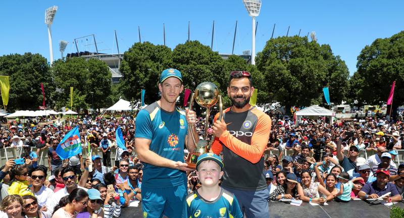 epa07246165 Australian captain Tim Paine (L) and Indian captain Virat Kohli (R) pose for photos during the launch of the India Summer Festival at the MCG in Melbourne, Australia, 23 December 2018.  EPA/MARK DADSWELL  AUSTRALIA AND NEW ZEALAND OUT