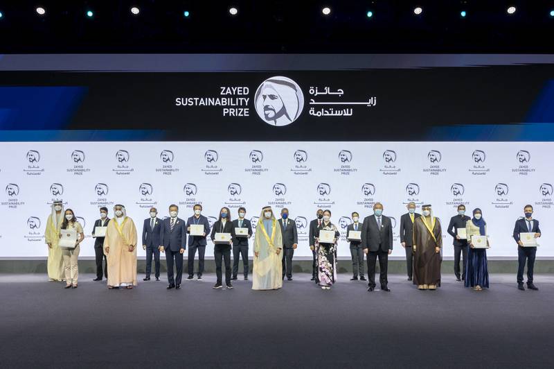 Sheikh Mohammed bin Rashid, Vice-President and Ruler of Dubai, front row sixth right, and Sheikh Mansour bin Zayed Al Nahyan, UAE Deputy Prime Minister and Minister of Presidential Affairs, front row third right, join presidents and ministers for a group photo with the Zayed Future Energy Prize winners at the World Future Energy Summit 2022 at the Dubai Exhibition Centre. MOPA
