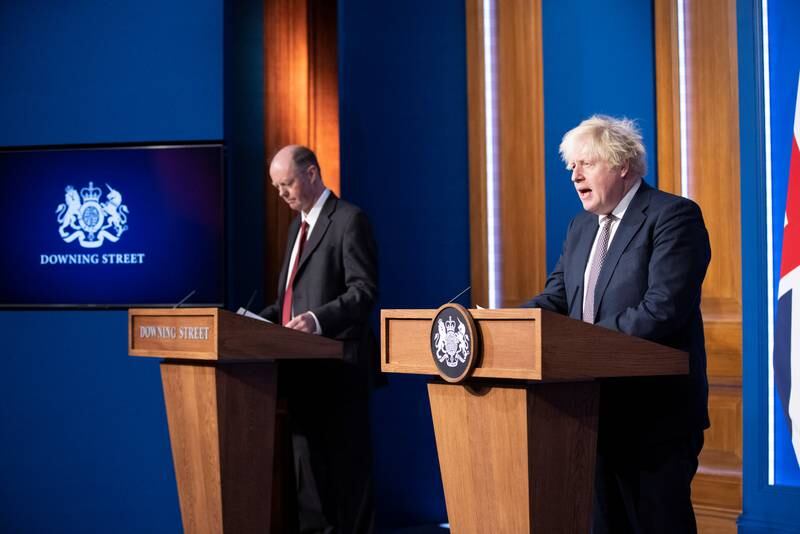 British Prime Minister Boris Johnson and Chief Medical Officer Chris Whitty during a press conference on the variant in London. Reuters