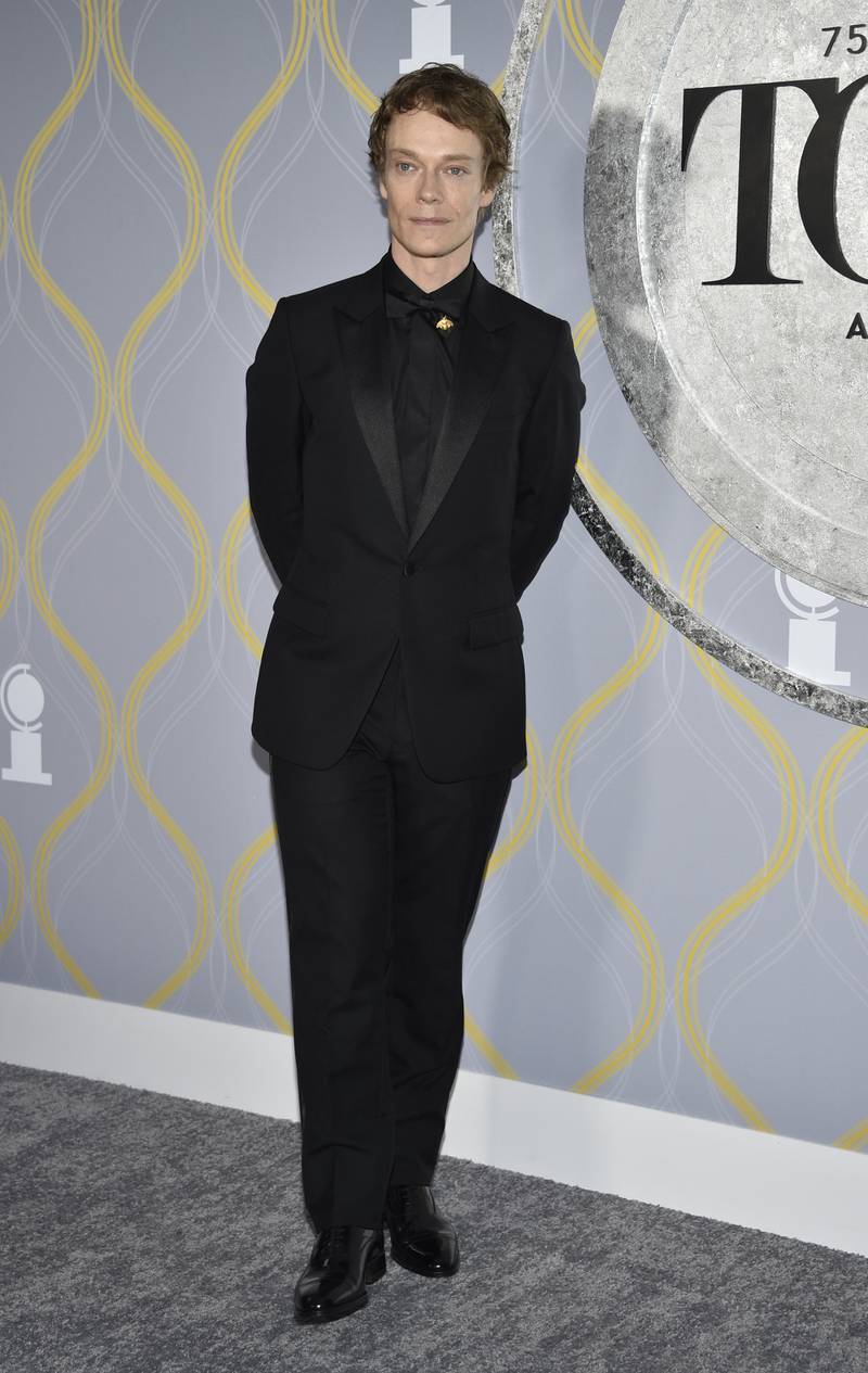 English actor Alfie Allen, of 'Game of Thrones' fame, dons an all-black suit. Invision / AP