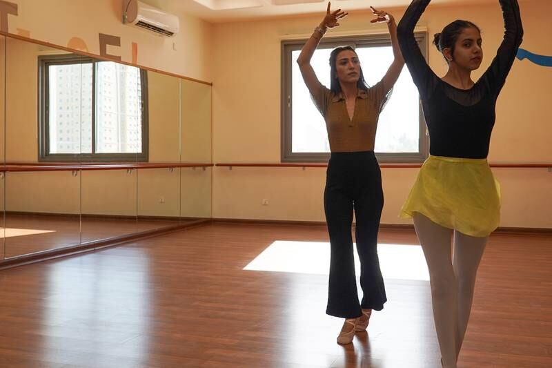 Iraqi ballet dancer Leezan Salam, left, with one of her students. Aymen Al-Ameri / The National