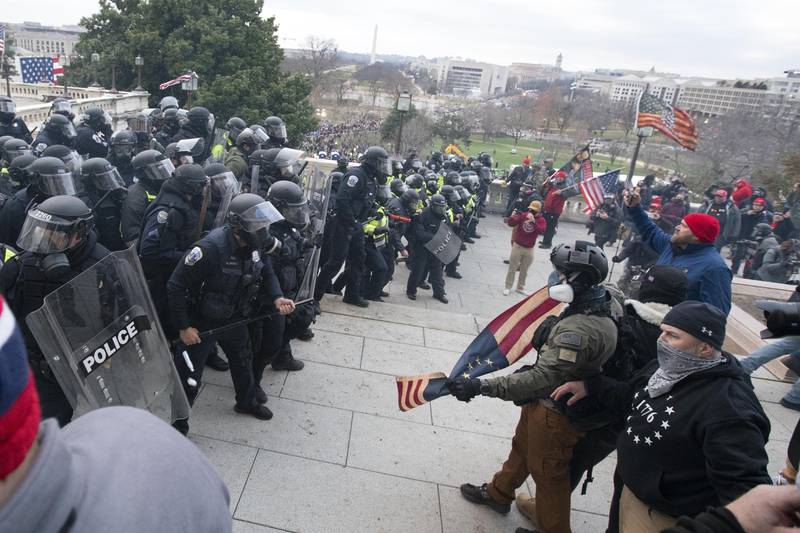 US Capitol Police push back rioters trying to enter the US Capitol. AP