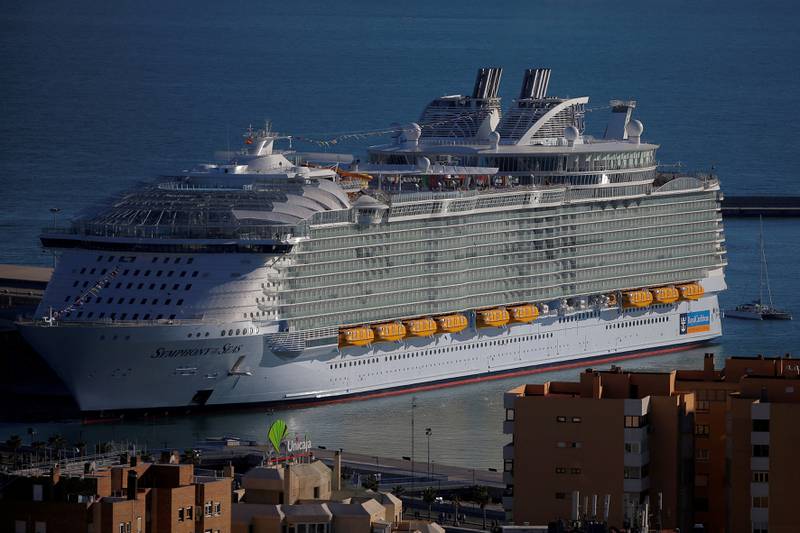 Royal Caribbean's 'Symphony of the Seas' features bionic robot bartenders, a waterfront entertainment zone and a water park with the Ultimate Abyss slide. Reuters