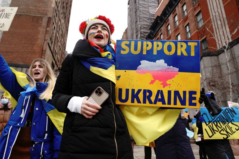 People protest outside the UN in New York against Russia's invasion of Ukraine. Reuters