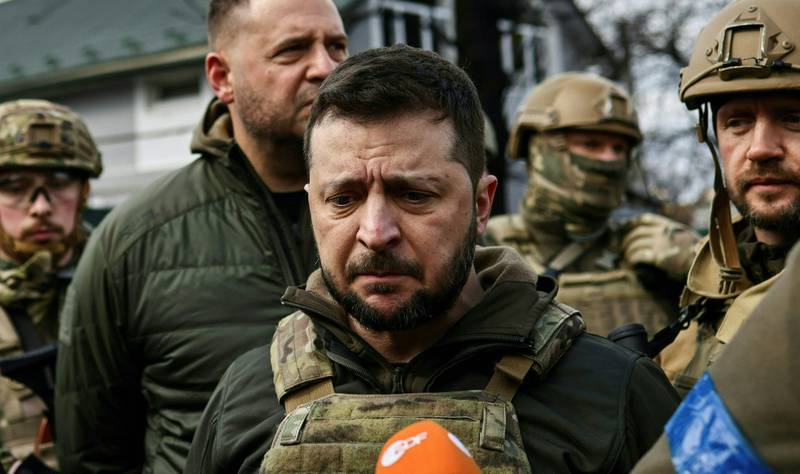 Mr Zelenskyy speaks to the press in the town of Bucha, north-west of Kyiv, in April 2022, where he said the Russian leadership was responsible for killing civilians. AFP
