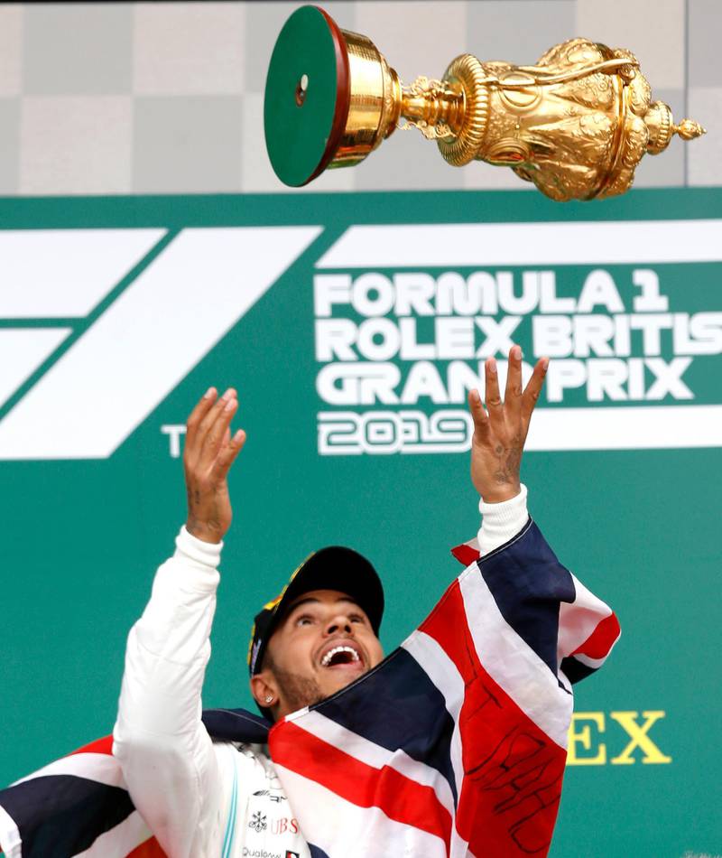 Lewis Hamilton celebrates at Silverstone last season. PA