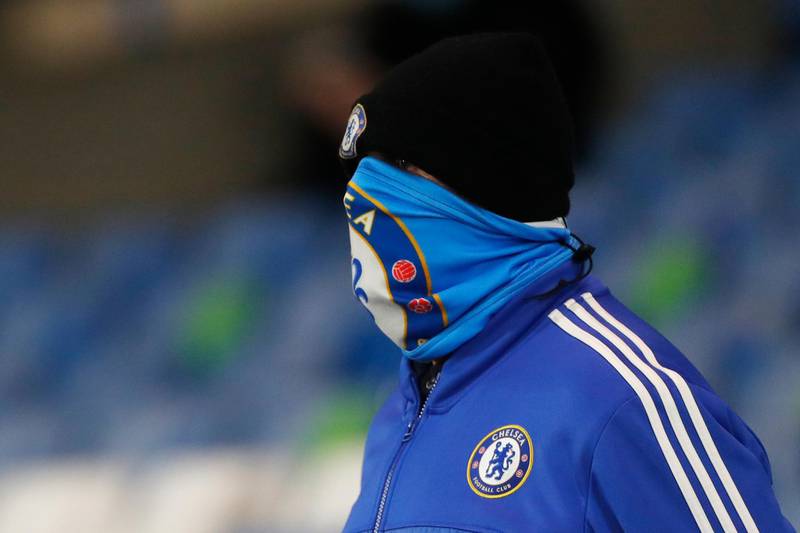 A Chelsea fan wearing a face mask at Stamford Bridge in London, England, ahead of the Premier League match against Leeds United on Saturday. AP