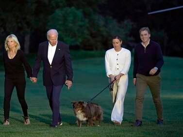 US President Joe Biden and First Lady Jill Biden, walk with their granddaughter Naomi Biden, her fiance Peter Neal and their dog Charlie at the South Lawn of the White House. AP
