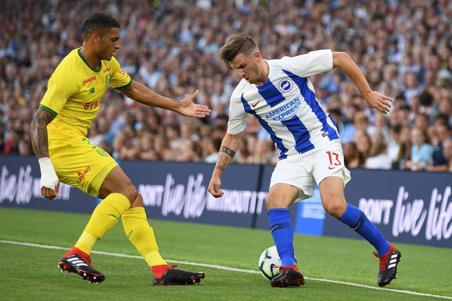 BRIGHTON, ENGLAND - AUGUST 03:  Pascal Gross of Brighton is challenged by Diego Carlos of Nantes during a Pre-Season Friendly between Brighton and Hove Albion and FC Nantes at Amex Stadium on August 3, 2018 in Brighton, England.  (Photo by Mike Hewitt/Getty Images)