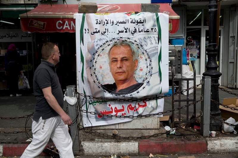 A banner with an image of Karim Younis in the occupied West Bank city of Ramallah. AP
