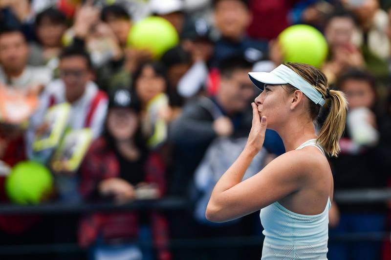 Maria Sharapova of Russia blows a kiss to the crowd after her victory over Mihaela Buzarnescu of Romania in the first round of the Shenzhen Open tennis tournament in Shenzhen, in China's southern Guangdong province on January 1, 2018. / AFP PHOTO / - / China OUT