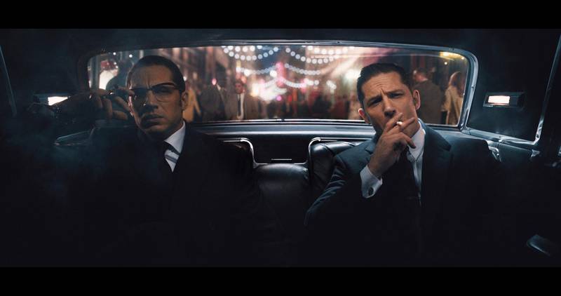 A handout movie still showing (L to R) Ronnie and Reggie Kray (TOM HARDY) in "Legend". From Academy Award® winner Brian Helgeland (L.A. Confidential, Mystic River) and Working Title comes the true story of the rise and fall of London's most notorious gangsters, both portrayed by Hardy in a powerhouse double performance. ​(Courtesy: Universal Pictures) *** Local Caption ***  8M60_TPT2_00004R.JPG