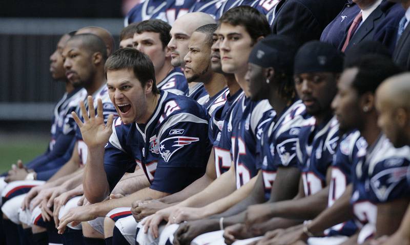 Patriots quarterback Tom Brady waves during a photoshoot at University of Phoenix Stadium in 2008. AP
