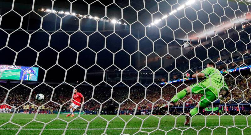 Alexis Sanchez scores the winning penalty in the shootout. Reuters
