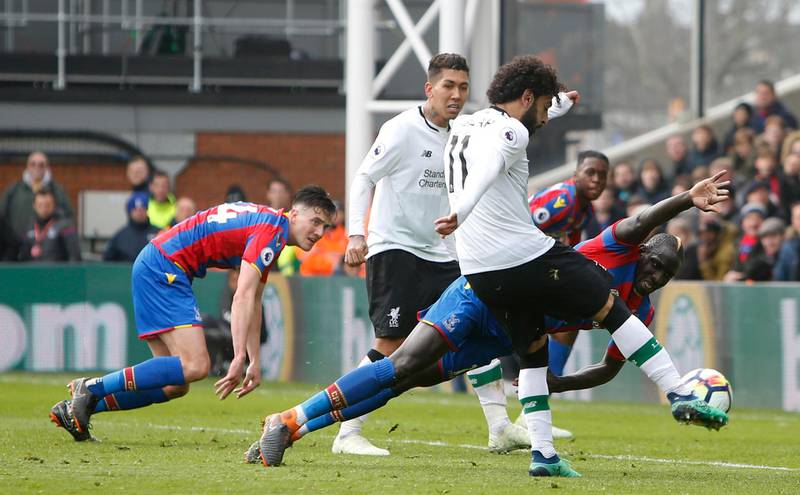 Liverpool's Mohamed Salah shoots and scores his side's second goal of the game during the English Premier League match between Crystal Palace and Liverpool at Selhurst Park on March 31, 2018. Liverpool won the match 2-1. Alastair Grant / AP Photo