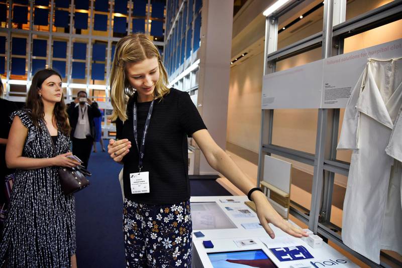 An exhibitor, right, explains her project to a woman attending the Global Grad Show during the Dubai Design Week at the Dubai Design District, Dubai, UAE, on Monday, Nov. 11, 2019. (Photos by Shruti Jain - The National)