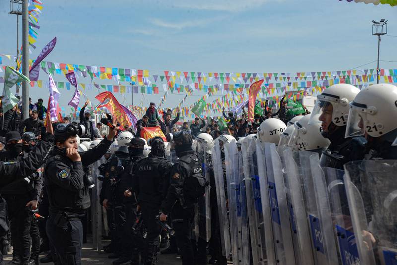 Ranks of riot police stand guard as Turkish Kurds celebrate Nowruz in Diyarbakir, southeastern Turkey. AFP