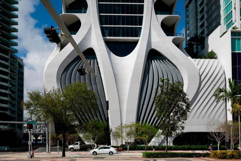 A partial view of One Thousand Museum building in Miami on February 19, 2020.  In the heart of Miami, among the towering skyscrapers that rise above the Bay of Biscayne, the eye-catching new luxury condo building by late star architect Zaha Hadid dominates the skyline.
The unique curved "exoskeleton" design of the One Thousand Museum building has created buzz. The futuristic building is the only residential space in downtown Miami with a helipad.
The building is also a way to honor the legacy of the Iraqi-British architect, who died in Miami in 2016 at age 65, when the 62-story One Thousand Museum tower was built up to about the eighth floor.
"We felt a big obligation to make sure we got this particular project right because Miami was her second home," said Chris Lepine, who took over as director of the $300 million project after her death.
 / AFP / Eva Marie UZCATEGUI / TO GO WITH AFP STORY by Leila MACOR on "Zaha Hadid's 'exoskeleton' tower an instant Miami landmark"
