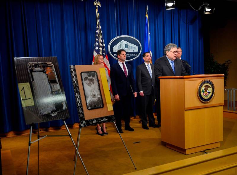 US Attorney General, William Barr speaks next to diplayed pictures of the shooter's cellphone at a press conference, regarding the December 2019 shooting at the Pensacola Naval air station in Florida, at the Department of Justice in Washington, DC on January 13, 2020. The United States will send 21 Saudi military trainees back to the Gulf kingdom after an investigation into the fatal shooting of three American sailors last month, the Justice Department announced Monday."The Kingdom of Saudi Arabia determined that this material demonstrated conduct unbecoming an officer in the Saudi Royal Air Force and Royal Navy and the 21 cadets have been dis-enrolled from their training curriculum in the US military and will be returning to Saudi Arabia later today," Barr said. / AFP / ANDREW CABALLERO-REYNOLDS

