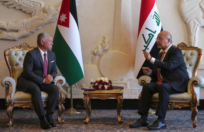 Iraqi President Barham Salih receives Jordanian King Abdullah II at Baghdad Airport. AFP