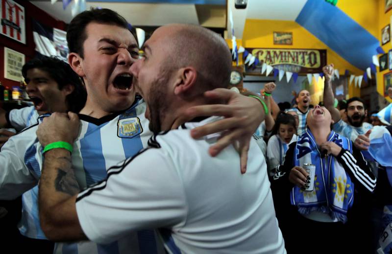 Fans react at an Argentinian restaurant during the match. Paulo Whitaker / Reuters