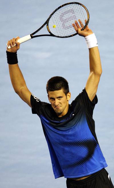 Serbian tennis player Novak Djokovic celebrates during his mens semi-final singles match against Swiss opponent Roger Federer in the Rod Laver Arena at the Australian Open tennis tournament in Melbourne, 25 January 2008.    Djokovic won 7-5. 6-3. 7-6.  AFP PHOTO/Peter PARKS (Photo by PETER PARKS / AFP)