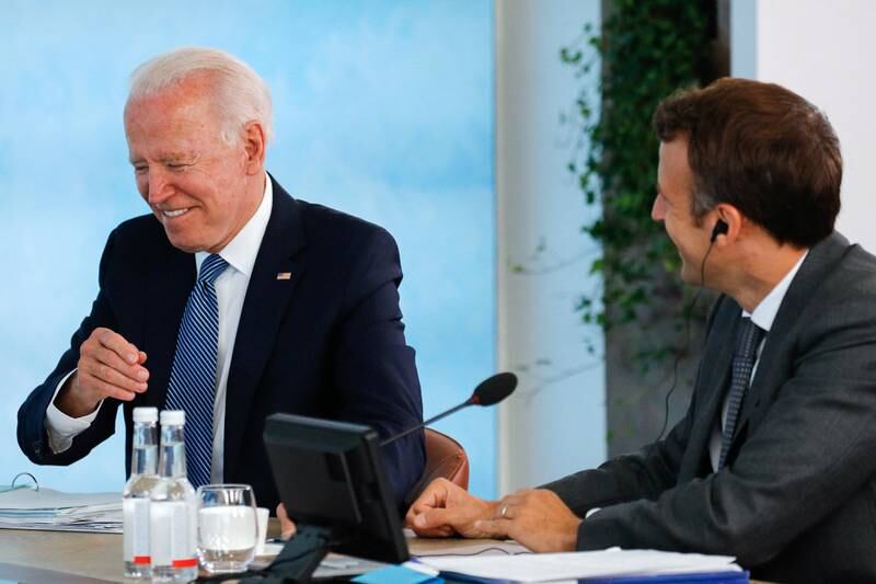 Mr Biden, left, and Mr Macron attend a plenary session during the G7 summit on June 13, 2021