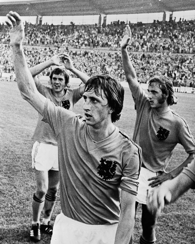 4th July 1974:  From left to right, Dutch footballers Johnny Rep, Johan Cruyff, and Johan Neeskens waving to the crowds before the World Cup Final against West Germany. (Photo by Keystone/Getty Images)