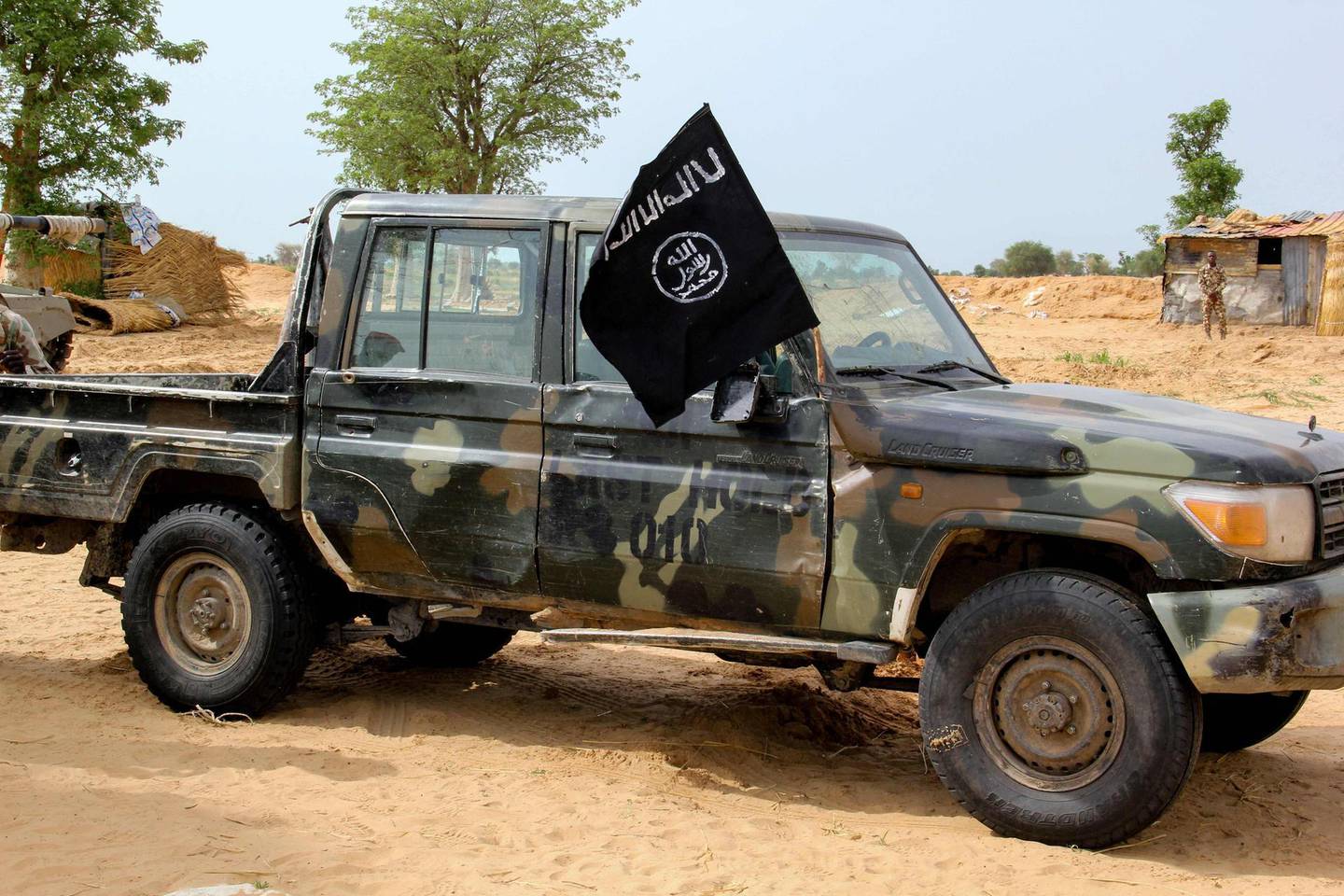 A vehicle allegedly belonging to the Islamic State group in West Africa (ISWAP) is seen in Baga on August 2, 2019. Intense fighting between a regional force and the Islamic State group in West Africa (ISWAP) has resulted in dozens of deaths, including at least 25 soldiers and more than 40 jihadists, in northeastern Nigeria.
ISWAP broke away from Boko Haram in 2016 in part due to its rejection of indiscriminate attacks on civilians. Last year the group witnessed a reported takeover by more hardline fighters who sidelined its leader and executed his deputy. The IS-affiliate has since July 2018 ratcheted up a campaign of attacks against military targets. / AFP / AUDU MARTE
