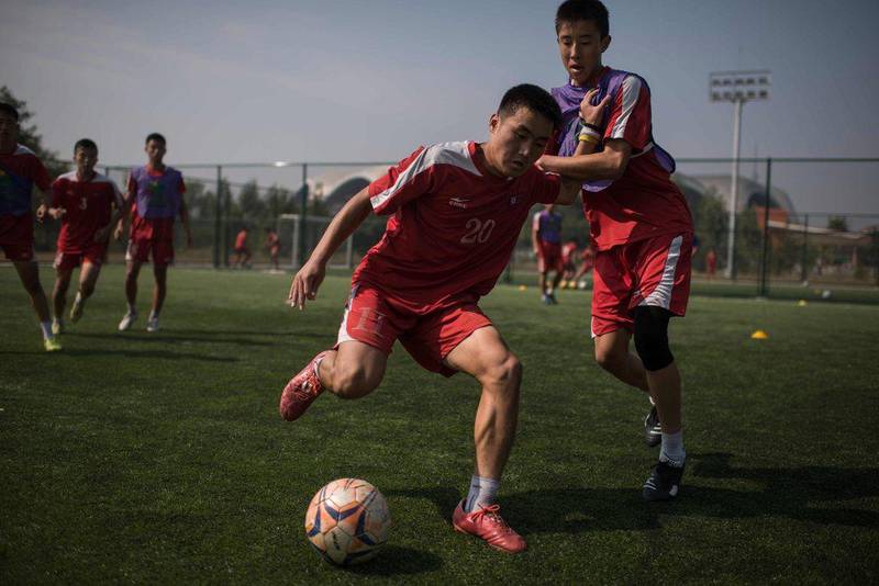 Students take part in an under-14 training session at the Pyongyang International Football School. Ed Jones / AFP