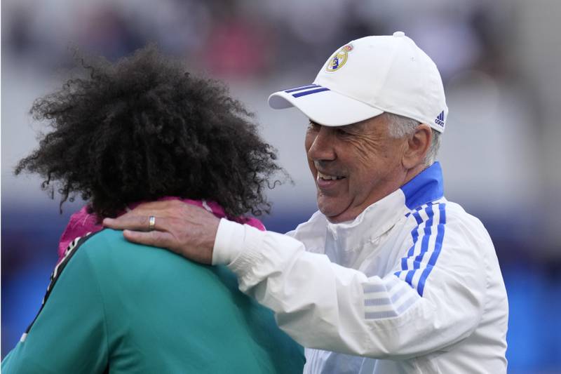 Real Madrid's coach Carlo Ancelotti, right, with Marcelo during training. AP