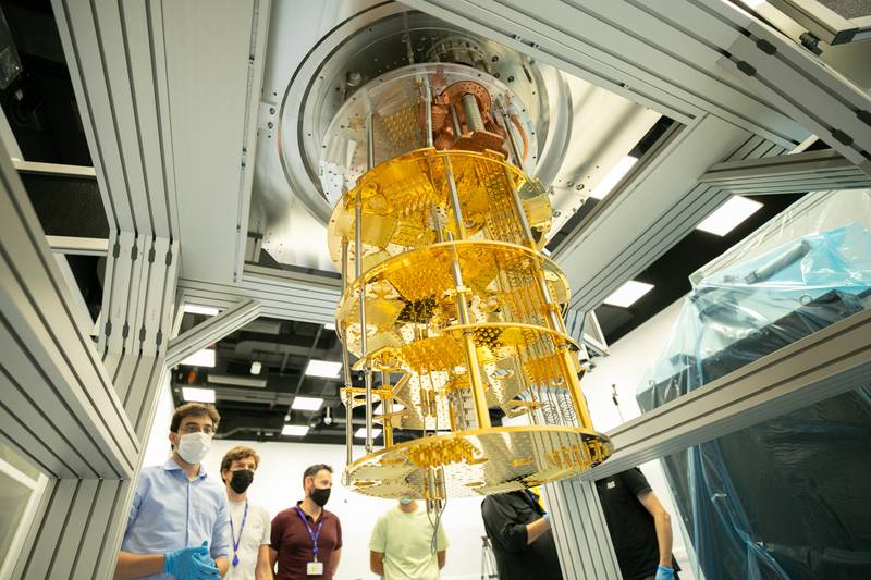 Two helium isotopes are mixed, cooling the chandelier to 10 millikelvin. The looping microwave communication cables enable other computers to interact with the quantum chip.