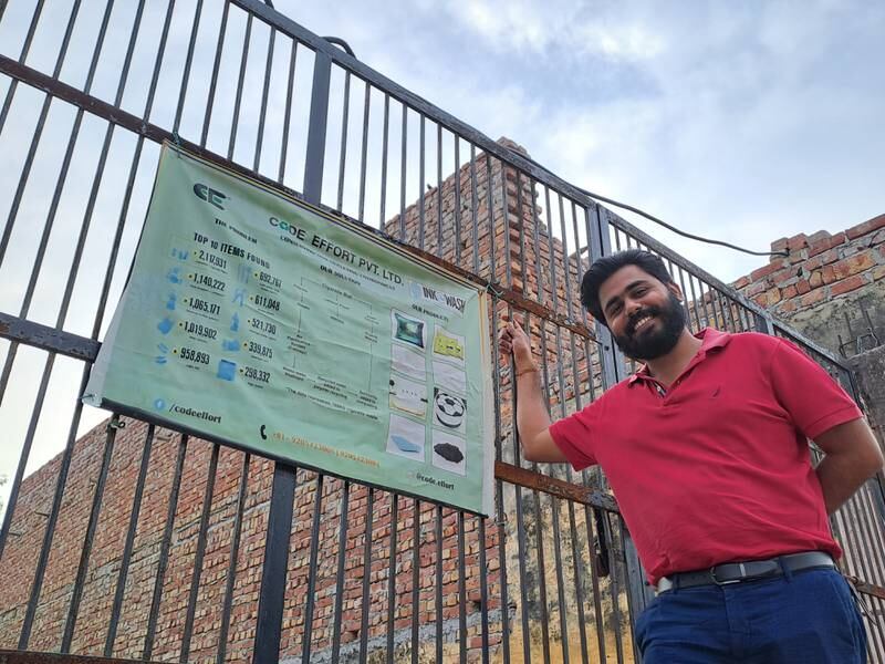 
Naman Gupta, 28, at the gate of the factory, which he started with his elder brother