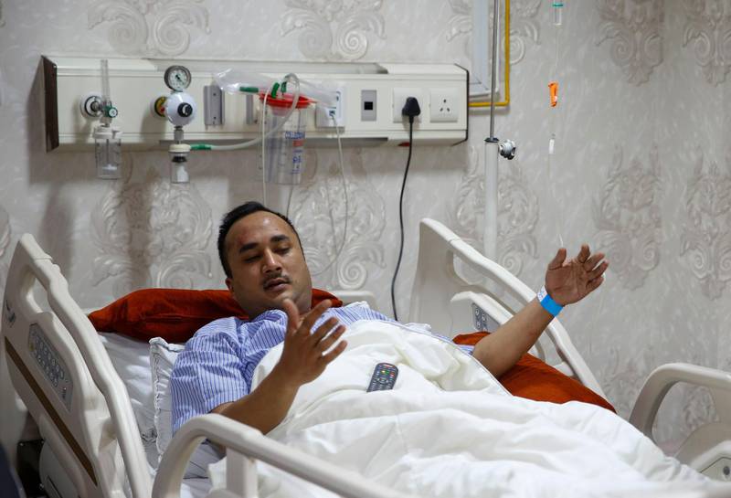 Plane crash survivor Nepalese Ashish Ranjit, who escaped from the craft's window, is being treated at the Norvic Hospital in Kathmandu. Narendra Shrestha / EPA