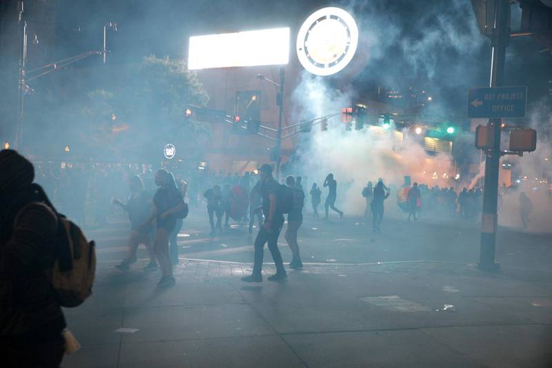 Demonstrators flee tear gas during a protest against the death in Minneapolis police custody of African-American man George Floyd, in Atlanta, Georgia on May 29, 2020. Reuters